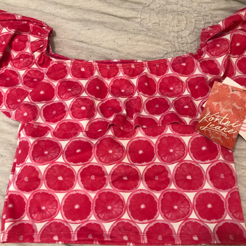 NWT Pink grapefruit ruffle around top Kortni Jeane